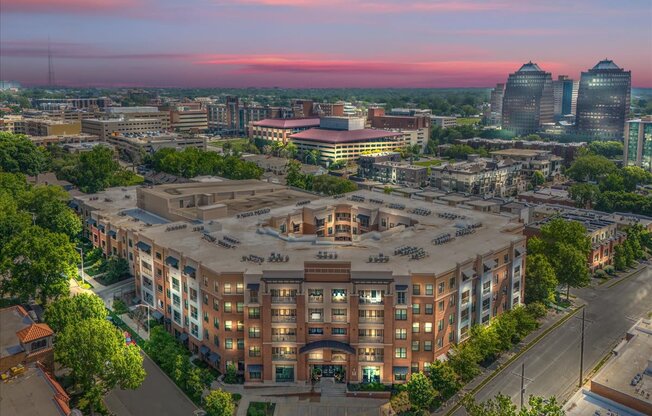 A large building with a parking lot in front of it.