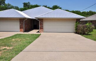 FOR LEASE! Nicely Remodeled 3 BR - 2 BA Brick Duplex With a 2 Car Garage in Weatherford