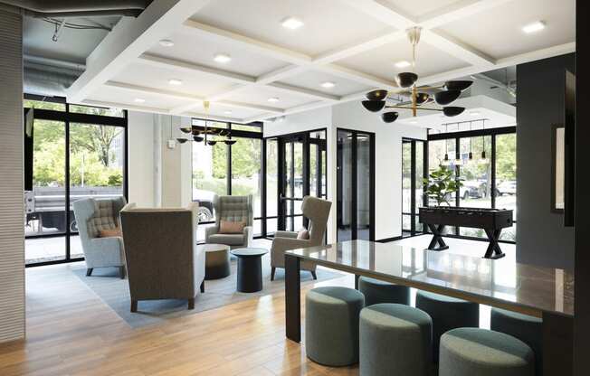 a conference room with a table and chairs and a piano