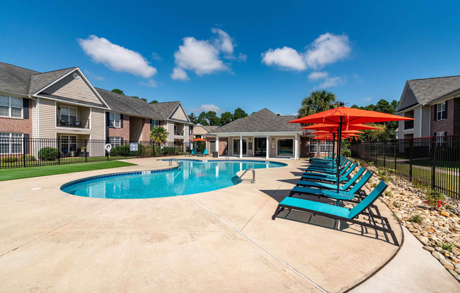 a resort swimming pool with a blue sky above it