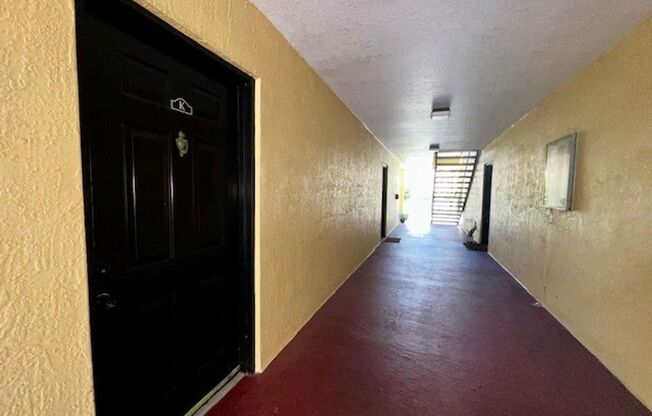 MOVE IN NOW!! Gated community Miriada! 1st floor 1X1.5 bath condo near pool area!!! Laminate wood flooring in living area and carpet in bedroom! Has washer & dryer! Gas stove & water heater!