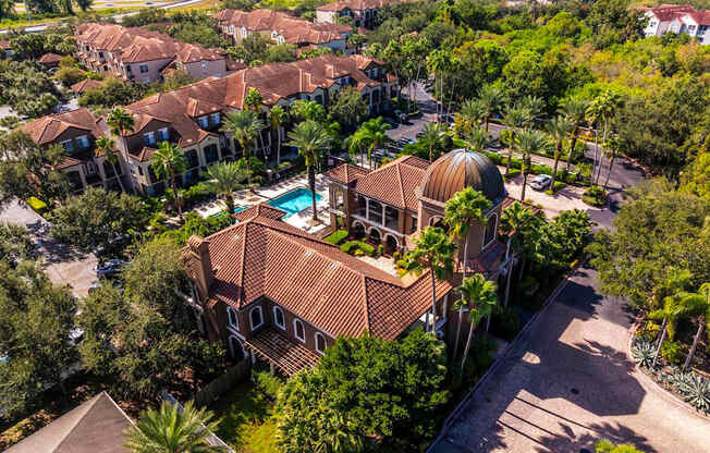 Elevated aerial of clubhouse with domed roof and landscaped courtyard