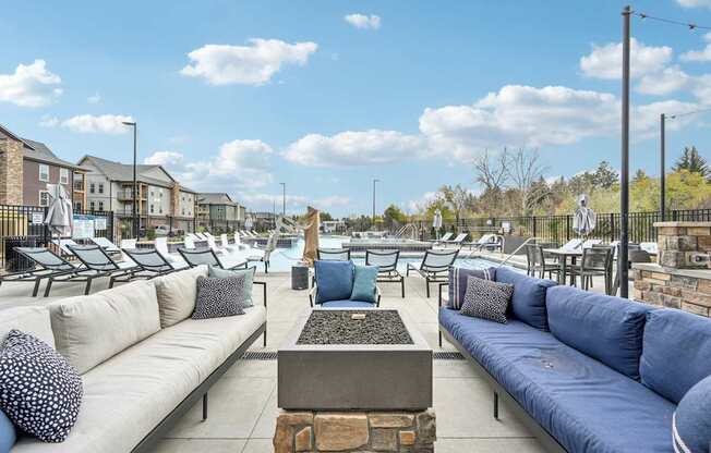 the terrace at the heights at harpers preserve has couches and tables at The Quarry Luxury Apartment Homes, Fort Collins, CO