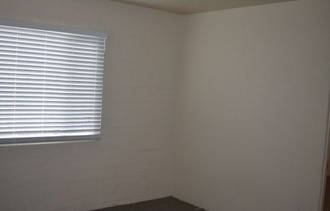 Darling Two Bedroom Home with all New Carpet/ Paint/ Dual Pane Windows/ Garage