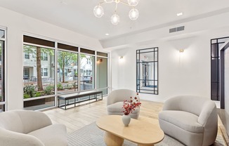 A living room with a wooden coffee table and a chandelier.