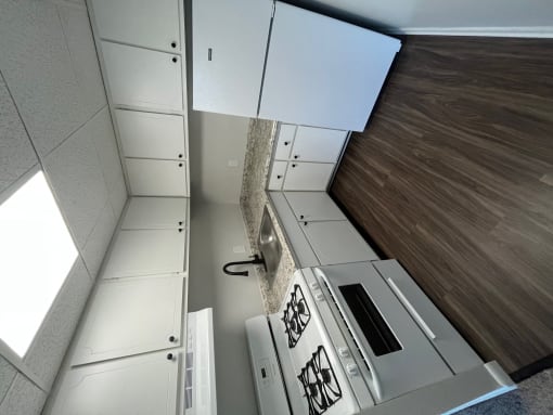 White kitchen cabinets and luxury vinyl planking