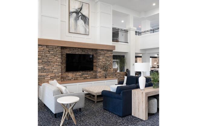 a living room filled with furniture and a fireplace