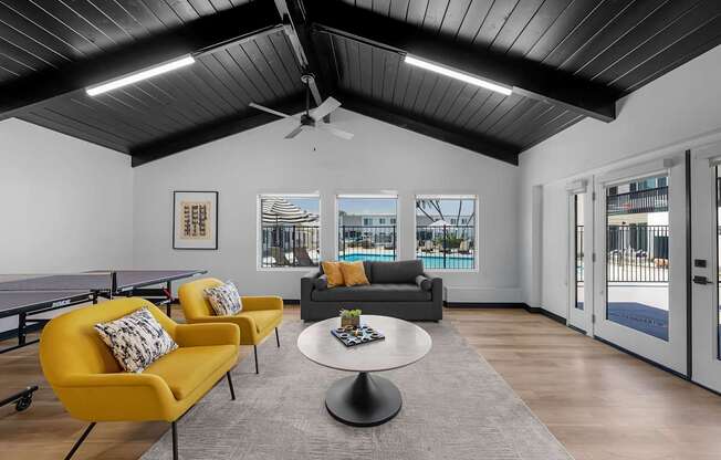 A living room with a pool view.