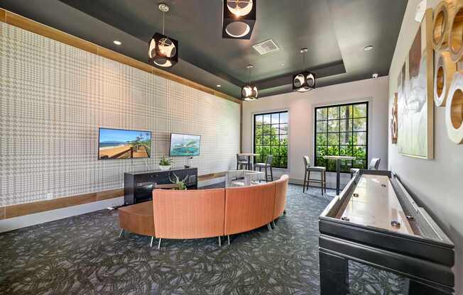 a lobby with a couch and a table and a pool