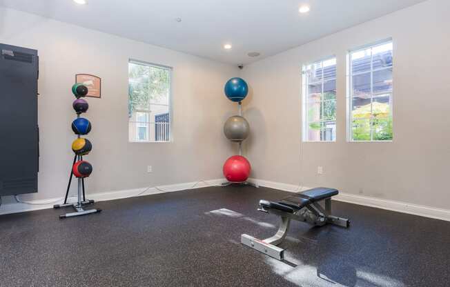 a workout room at the enclave at woodbridge apartments in sugar land, tx