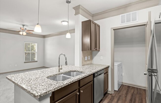 a kitchen with a sink and a dishwasher