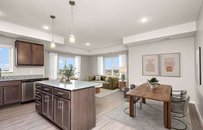 A modern kitchen with a wooden island and a dining table set up.