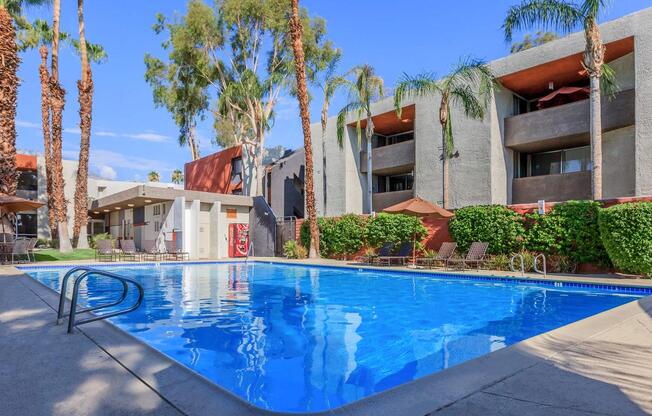 a house with a pool in front of a building