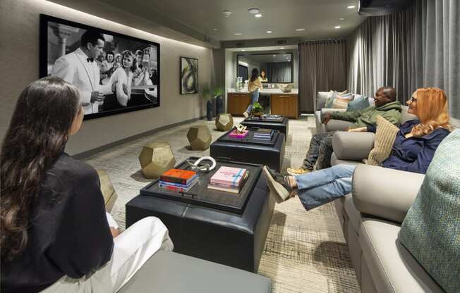 a living room filled with furniture and a large flat screen tv