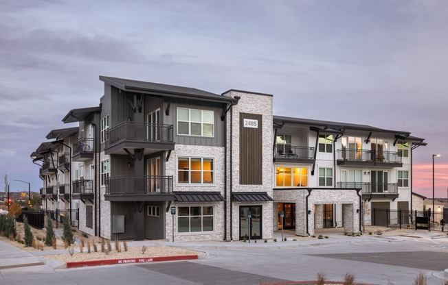 an image of an apartment building on a city street