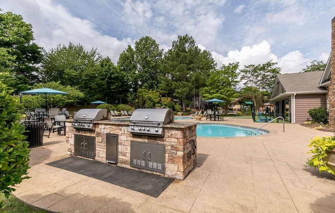 Grilling station and pool at Elme Marietta Apartments, Marietta, GA