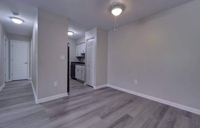 a bedroom with hardwood flooring at the whispering winds apartments in pearland, tx