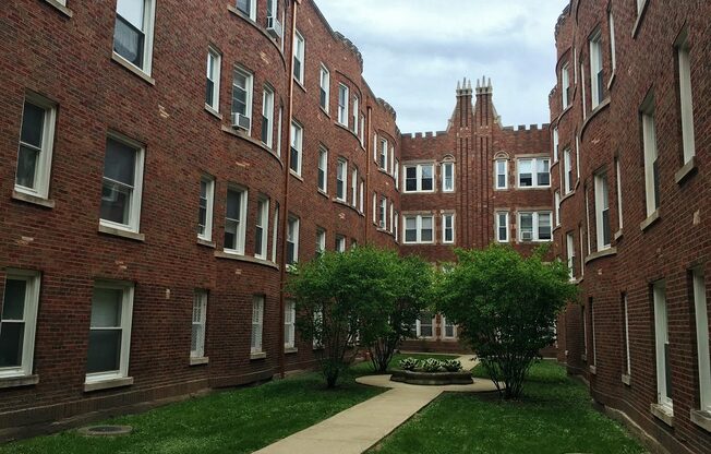 Historic brick exterior with a lovely courtyard