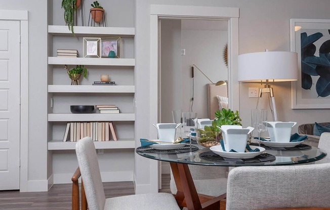 a dining room with a table and chairs