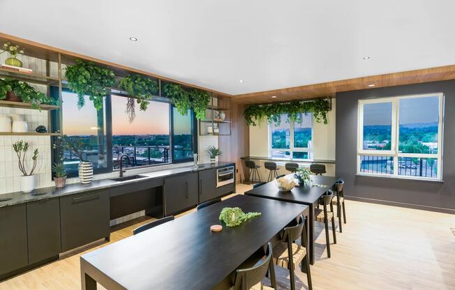 Host with ease in the elevated clubroom at Modera Beaverton, featuring sleek finishes and panoramic city views.