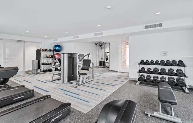 the gym at the enclave at woodbridge apartments in sugar land, tx