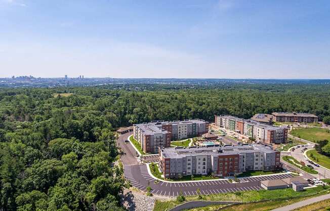 an aerial view of a campus with trees and buildings