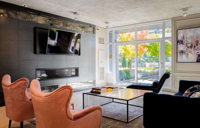 a living room with a couch and a coffee table and a television