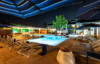 Outdoor pool area with lounge chairs