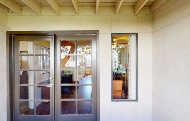 a house with two doors and two windows