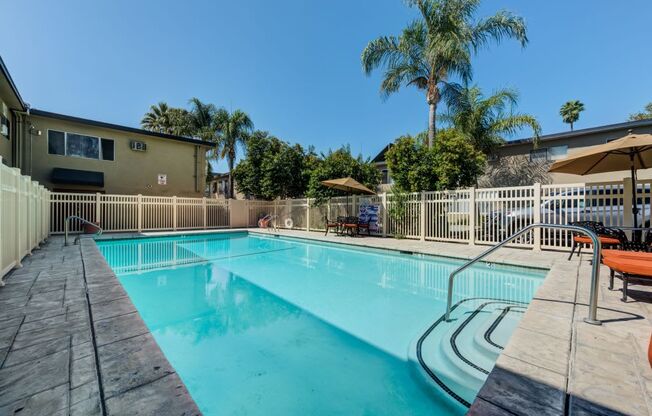 Luxury Apartments in Canoga Park For Rent - Parthenia Terrace - Gated Pool Surrounded by Lounge Seating