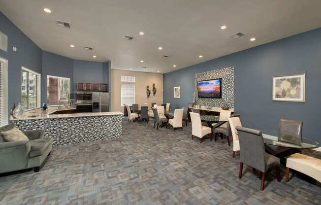 a conference room with a table and chairs and a television at Veranda at Centerfield, Texas