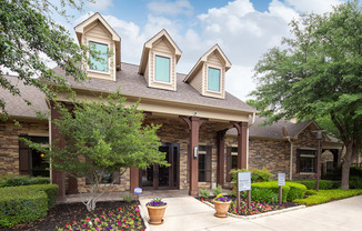 a home with a walkway in front of it