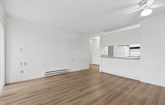A room with wooden floors and white walls.