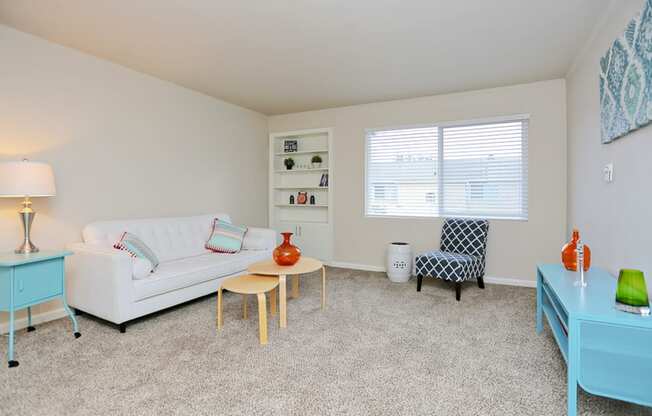 a living room with a couch and a table and a window at Woodhaven, Everett, WA