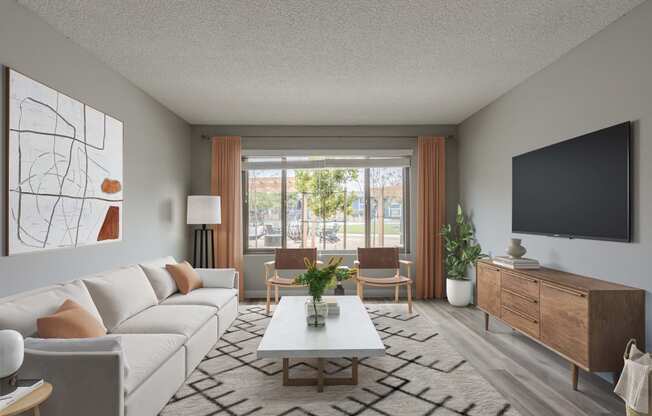 a living room with a white couch and a coffee table