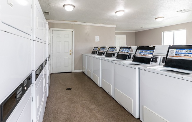 the laundry room is equipped with washers and dryers