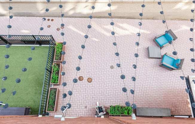 an aerial view of a patio with a lawn and television set