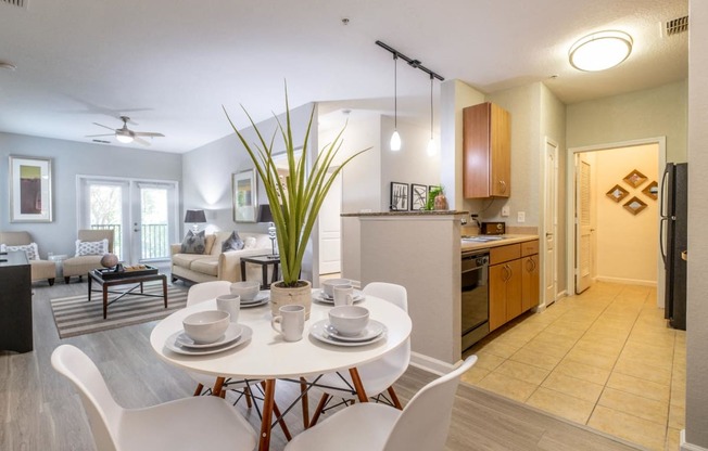 a dining room and living room at Verano apartments