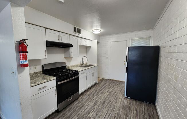 2 bedroom 1 bathroom unit, nice white shaker kitchen cabinets!