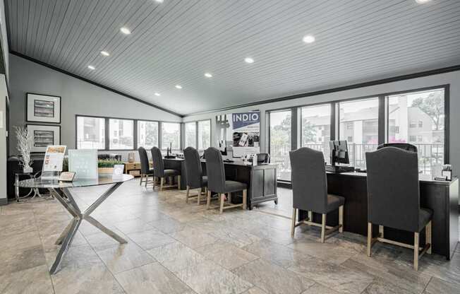 the lobby of a restaurant with tables and chairs