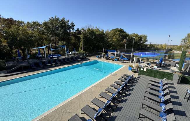 an aerial view of a swimming pool with lounge chairs at The Boulevard, Roeland Park, KS