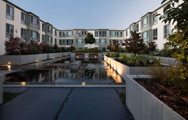 Inner courtyard with a water feature and sitting area.