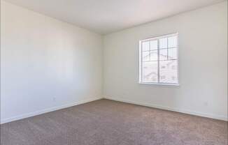 A room with a carpeted floor and a window at Riverplace Apartment Homes, Independence, 97351