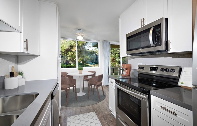 Staged updated kitchen and dining area
