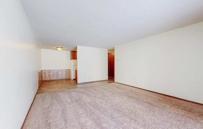 a bedroom with a carpeted floor and white walls