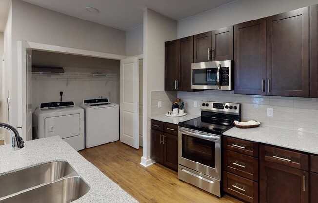 a kitchen with a stove and a sink at The Fitzroy San Marcos, San Marcos
