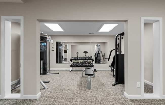 the gym at the enclave at woodbridge apartments in sugar land, tx at Millcreek Woods Apartments, Olathe