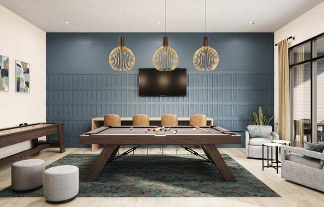 a living room with a pool table and a tv