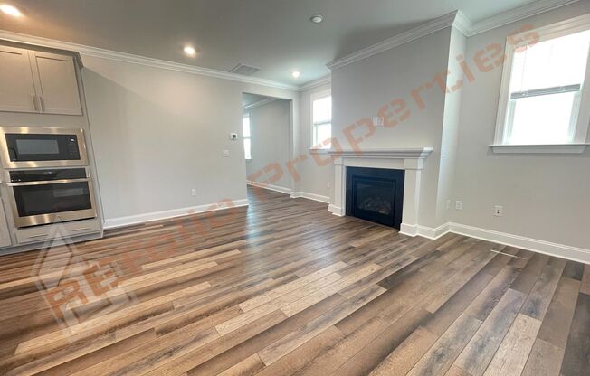 Beautiful 4 Bedroom 2.5 Bath Home with 2 Car Rear Entry Garage, First Floor Primary Bedroom Suite & Fireplace Plus Fiber Internet Included in Edge of Auburn Subdivision, Available June 6th!