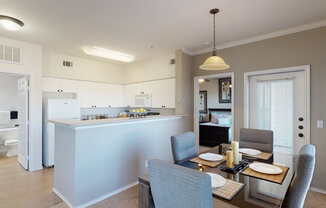 a kitchen and dining area in a 555 waverly unit